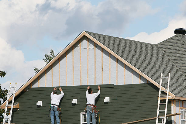 Professional Siding technician working in North Andover, MA